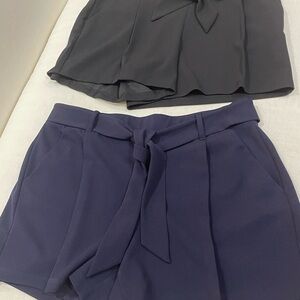 Blue and Black polyester shorts with tie belt.